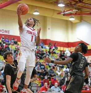 Penn Hills’ Noah Barren (1) splits the defense and scores two points during the second half of Penn Hills’ victory over Gateway on Tuesday, Jan. 24, 2023, at Penn Hills.