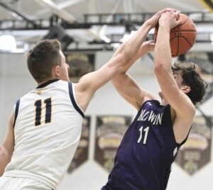Central Catholics Dante DePante blocks the shot of Baldwins Nathan Wesling during WPIAL Class 6A boys quarterfinal action Friday at Moon.