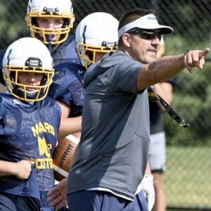 Mars head coach Eric Kasperowicz works with his team during practice on Wednesday, Aug. 9, 2023, at Mars.