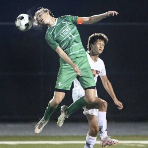 South Fayette’s Cole Johnson heads the ball over Moon’s Shak Otabekov during their game on Thursday, Sept. 7, 2023, at South Fayette.
