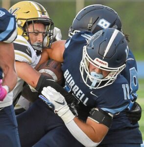 Burrell’s Devin Beattie (11) fights for extra yards on Friday, September 8, 2023, at Burrell High School.