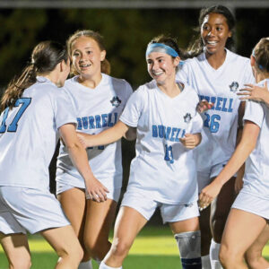 Burrells Tessa Mathabel (13) celebrates her second goal, the game-winner, with teammates during their game against Deer Lakes on Monday, Sept. 11, 2023, in West Deer.