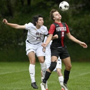 Sewickley Academys Andrew Colletti battles OLSHs Holland Cobourne for possession during their game on Tuesday in Edgeworth. Sewickley Academy won, 2-1.