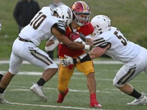 Highlands Julius Sanders and Angelo Markey try to tackle North Catholics Jack Fennell on Thursday, Sept. 15, 2023, at J.C. Stone Field.