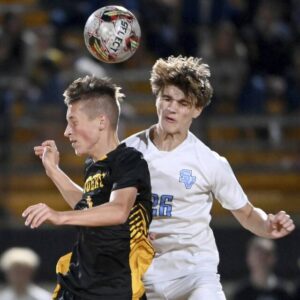 North Alleghenys William Love battles Seneca Valleys Evan DeMarco for a header during their game Tuesday in McCandless.