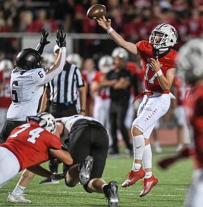 Peters Township quarterback Nolan DiLucia (17) throws a pass under pressure on Friday, Sept. 22, 2023, at Peters Township High School.