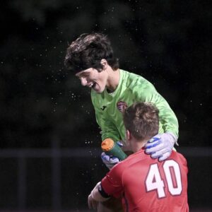 Avonworth goalkeeper Alexander Rowe celebrates with Aiden Osekowski after defeating Quaker Valley, 2-1, on Tuesday, Sept. 26, 2023, in Ohio Twp.