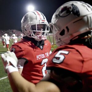 Peters Townships Nate Miller (2) celebrates with Carter Shanafelt after Shanafelt scored his first touchdown against Moon on Friday, Oct. 6, 2023, at Peters.