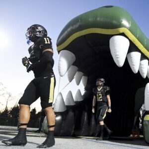 Gateway’s Marc Knight (11) takes the field with quarterback Brad Birch before their game against McKeesport on Friday, Oct. 13, 2023, in Monroeville.