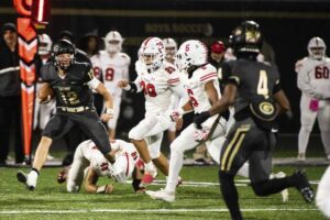 Gateway’s Brad Birch (12) dodges Moon defenders on an attempted run against Moon on Friday, Nov. 3, 2023 at Gateway High School’s Antimarino Stadium.