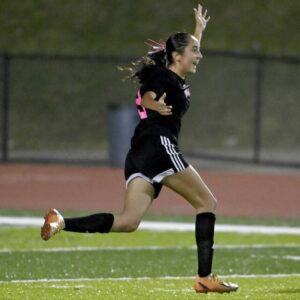 Moons Lilly Snyder celebrates after scoring in double overtime to defeat Montour on Oct. 4.