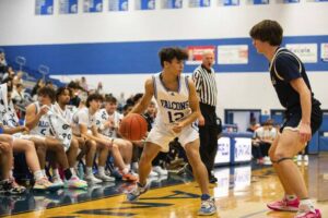 Connellsville’s Isiac Saylor looks for an opening against Franklin Regional’s Jonah Johnson on Friday, Dec. 1, 2023 at Hempfield High School.