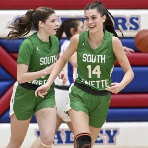 South Fayette’s Juliette Leroux celebrates with Haylie Lamonde after scoring during their game on Monday, Dec. 11, 2023, at Chartiers Valley.