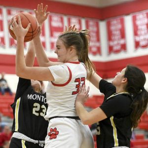 Moons Maria Depner grabs a rebound between Montours Zoe Woessner (23) and Sienna Palmer during their game on Tuesday in Moon.