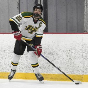 Penn-Trafford captain Cam Kiste looks to pass against Fox Chapel on Thursday, Nov. 21, 2024, at Alpha Ice Complex in Harmar.