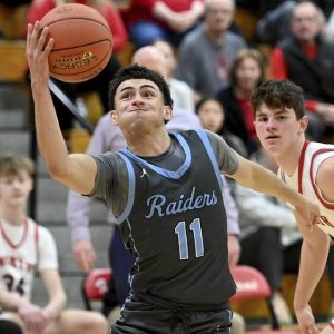 Seneca Valley’s Tyler Pepin drives to the basket against North Hills on Friday.