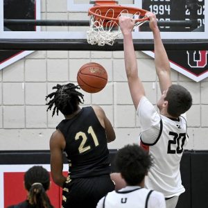 Upper St. Clair’s Tyler Robbins dunks against Imani Christian on Jan. 7.
                                Upper St. Clair’s Tyler Robbins dunks against Imani Christian’s D.J. Craighead during their game on Tuesday, Jan. 7, 2024, at USC.