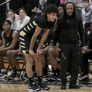 Imani Christian coach Khayree Wilson talks with Kieshaun Demus during their game against Upper St. Clair on Jan. 7.