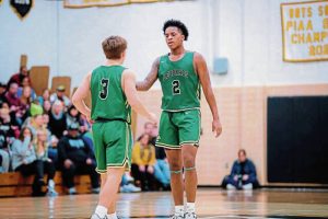 Belle Vernon’s Trevor Kovatch (3) congratulates Zion Moore during a 2023 WPIAL Class 4A first-round playoff game against Quaker Valley.
