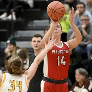 Peters Townships Natalie Wetzel shoots a 3-pointer over Thomas Jeffersons Allie Wilson on Dec. 12, 2024.