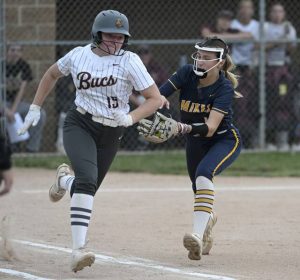Carmichaels’ Bailey Barnyak tags out Chartiers-Houston’s Seanna Riggle during a PIAA Class A softball quarterfinal last season.