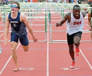 North Hills’s Gamaliel Mogire edges Norwin’s Ryan Schiller in a semifinal heat of the 110 hurdles during the WPIAL Class 3A Track and Field Championships on May 14 at Slippery Rock University.