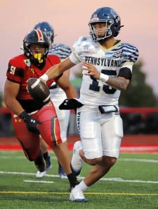 Central Catholic quarterback JyAire Walls looks for some place to run as he plays for Pennsylvania during the 68th annual Big 33 Classic on May 25, 2025, at Cumberland Valleys Chapman Field.