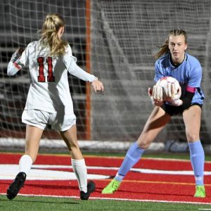 Peters Twp. goalkeeper Molly Kubistek makes a save in front of Fox Chapel’s Madeline Grimsley during their game on Monday, Oct. 14, 2024, at Peters.
