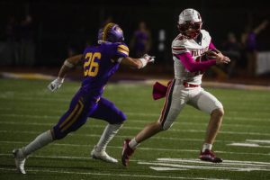 Fox Chapel’s Joey Geller is pressured by Plum’s Nick Sheffo last season.