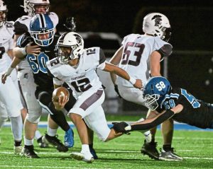 Greensburg Central Catholic’s Samir Crosby avoids the tackle attempt by Leechburg’s Ben Talarico on Oct. 25, 2024.