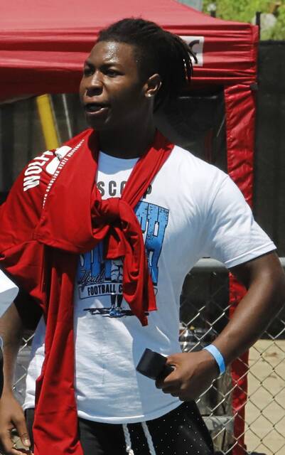 Woodland Hills linebacker Zykir “Ziggy” Moore, shown working at teammate Scoop Smith’s football camp, committed to NC State.