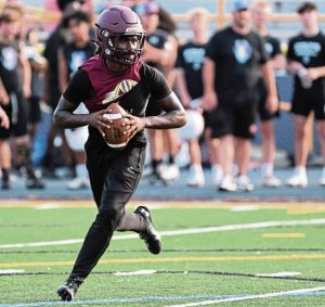 Steel Valley quarterback Da’ron Barksdale rolls out during a 7-on-7 competition at Mt. Lebanon High School.