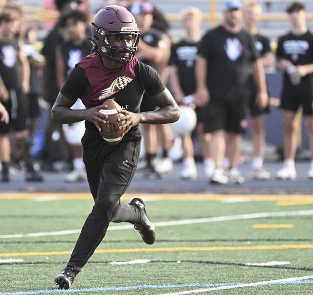 Steel Valley quarterback Da’ron Barksdale rolls out during a 7-on-7 competition at Mt. Lebanon High School.