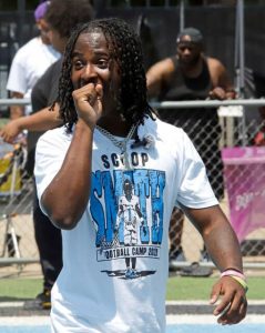 Woodland Hills football player Scoop Smith enjoys some of the action during his camp July 6, 2025.