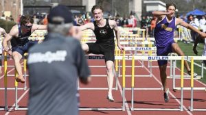 Quaker Valley’s Davin Gartley beats Norwin’s Ryan Schiller (second) and Plum’s Owen Proskin (third) in the 110-meter hurdles during the Butler Invitational on April 17 at Butler High School.