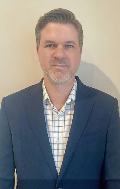 Justin Glock is the new head coach for the North Allegheny hockey team.