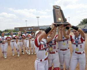 Neshannock softball captains hoist the state championship trophy after defeating South Williamsport in the PIAA Class 2A final on June 12 at Penn State.