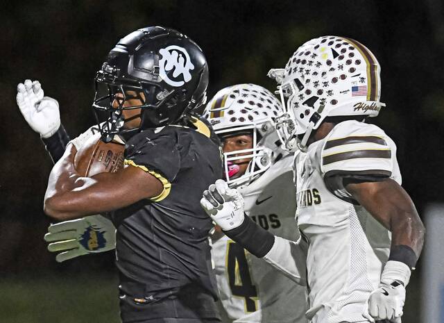 Imani Christian Academy’s Gabriel Jenkins (left) is chased down by Highlands’ Darius Cherry (center) and Jahmar Wright (right) after a long run on Friday, Nov. 8, 2024, at UPMC Graham Field.