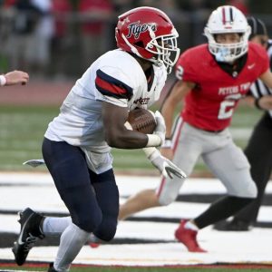 McKeesport’s Kemon Spell carries during the second quarter against Peters Township on Friday, Aug. 30, 2024, at Peters.