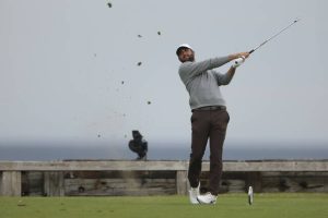 Scottie Scheffler plays his tee shot on the sixth hole during the first round of the British Open on Thursday.