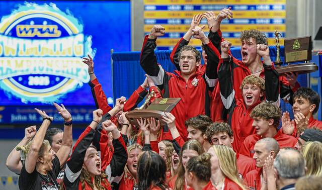 The Indiana boys and girls swim teams celebrate after being presented with 2025 WPIAL Class 2A team championship trophies Feb. 28 at Pitt’s Trees Pool.