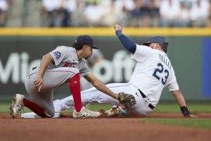 Seattle’s Rowdy Tellez steals second as Red Sox second baseman David Hamilton reaches to make the tag during a June 17 game.