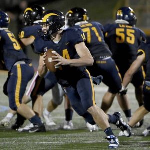 Mt. Lebanon quarterback Patrick Smith scrambles to pass on Friday, Sept. 6, 2024, against Peters Twp.