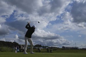 Scottie Scheffler hits his tee shot on the ninth hole during the third round of the British Open on Saturday.