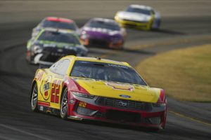 Joey Logano drives through Turn 3 during a NASCAR Cup Series race in June at Pocono Raceway.