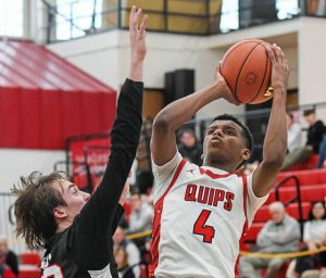 Aliquippa’s Josh Pratt (right) attempts a shot over Westmont Hilltop’s Jack Wesner in a PIAA Class 3A first-round game Saturday, March 8, 2025, at Aliquippa.