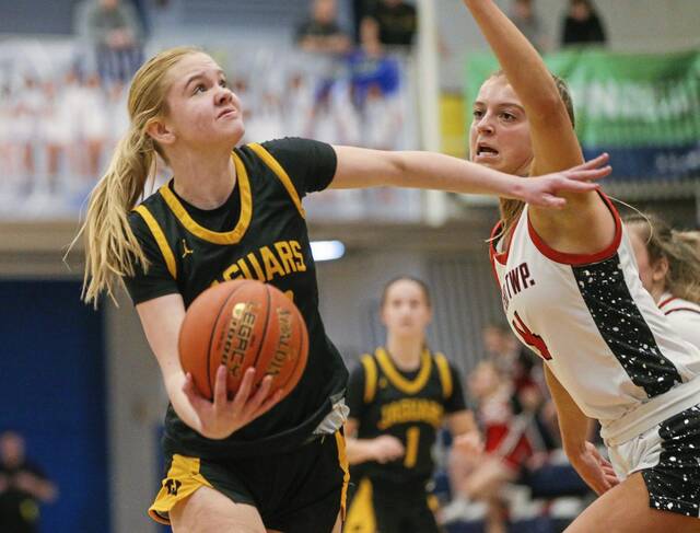 Thomas Jefferson’s Maggie Spell looks for a shot as Peters Township’s Natalie Wetzel defends in a PIAA Class 5A second-round game Wednesday, March 12, 2025.
