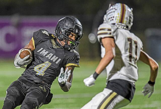 Imani Christian Academy’s David Davis (4) cuts back against Highlands’ Aiden Burford on Friday, Nov. 8, 2024, at UPMC Graham Field.