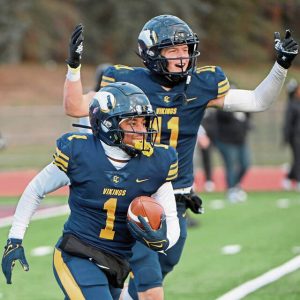 Central Catholic’s Chrys Black (1) celebrates with Bradley Gompers after intercepting a pass in the end zone to seal the victory against Harrisburg during a PIAA Class 6A semifinal Nov. 30, 2024, at Mansion Park in Altoona.