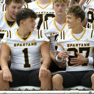 Montour’s Dylan Rogers (1) and Caden Halajcio (27) prepare for the team photo with teammates on picture day Thursday, Aug. 7, 2025, in Robinson.